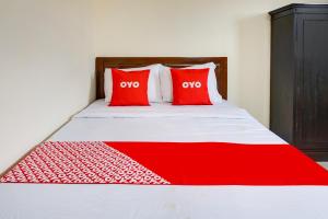Rúm í herbergi á OYO Life 91569 Omah Wijaya Kusuma Syariah