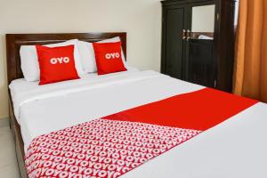 Rúm í herbergi á OYO Life 91569 Omah Wijaya Kusuma Syariah +18 myndir