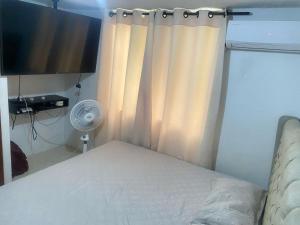 Ένα ή περισσότερα κρεβάτια σε δωμάτιο στο Apartamento en Villa Carolina