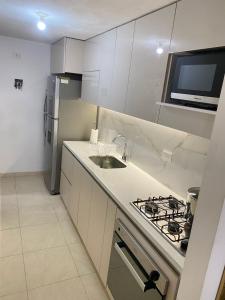 Η κουζίνα ή μικρή κουζίνα στο Apartamento en Villa Carolina