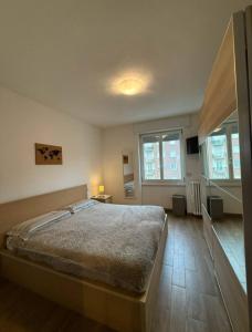 Ένα ή περισσότερα κρεβάτια σε δωμάτιο στο Stanza in appartamento luminoso e silenzioso