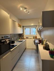 Η κουζίνα ή μικρή κουζίνα στο Stanza in appartamento luminoso e silenzioso