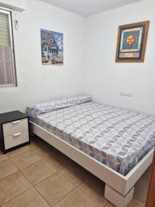a bedroom with a bed in a room at Apartamento ILA in Gandía +22 photos