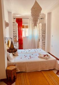 a bedroom with a large bed in a room at Ventana al mar , Tánger in Tangier