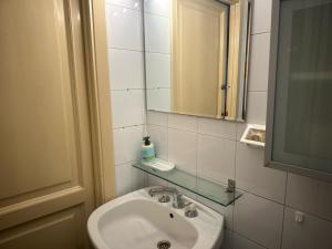 a bathroom with a sink and a mirror at Ostiense 6 in Rome