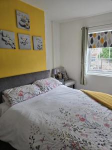 a bedroom with a bed and a window at Jasmyne Cottage in Wainfleet All Saints +27 photos