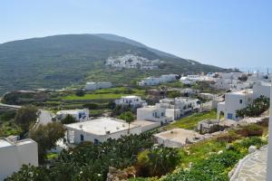 an aerial view of a town with white buildings at Aeon Blue in Sikinos