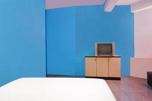 TV a/nebo společenská místnost v ubytování Hotel O Rafika Homestay SyariahNearTempat Makan Pagi Sore Nohil