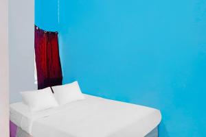 Postel nebo postele na pokoji v ubytování Hotel O Rafika Homestay SyariahNearTempat Makan Pagi Sore Nohil + 22 fotografií