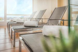 a row of empty chairs in a room at PARKHOTEL Hameln in Hameln