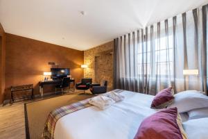 Cama o camas de una habitación en Castilla Termal Burgo de Osma