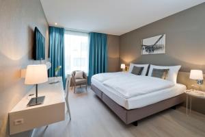Giường trong phòng chung tại Hotel Kettenbrücke