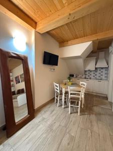 a kitchen and dining room with a table and chairs at Conchiglia Doro in Civitanova Marche