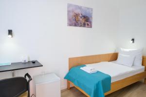 Voodi või voodid majutusasutuse Hotel Adalbert Szent György Ház toas