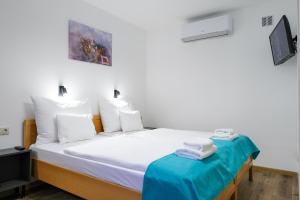 Voodi või voodid majutusasutuse Hotel Adalbert Szent György Ház toas