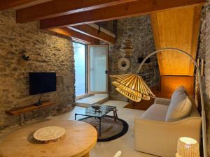 a living room with a couch and a table at Agi Porthos Apartments in Roses