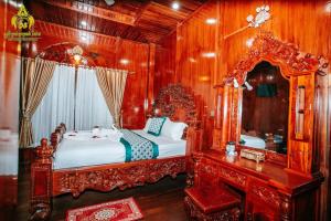 Postel nebo postele na pokoji v ubytování Srey Krob Leak Resort , ស្រីគ្រប់លក្ខណ៌ រីសត + 13 fotografií