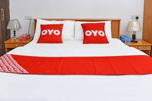 Postel nebo postele na pokoji v ubytování OYO 140 Al Musafir Hotel