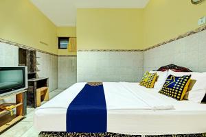 Postel nebo postele na pokoji v ubytování OYO Life 91677 Hotel Citra Dewi 3