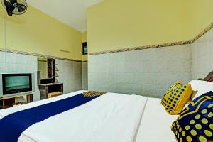 Postel nebo postele na pokoji v ubytování OYO Life 91677 Hotel Citra Dewi 3