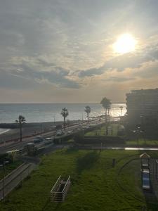 a view of the beach and the ocean from a building at Casa Paloma in Ventimiglia