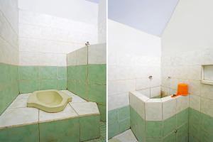 Vannituba majutusasutuses OYO 91710 Hotel Anugerah