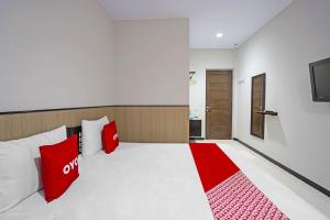 Voodi või voodid majutusasutuse OYO 91710 Hotel Anugerah toas