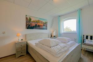 Ένα ή περισσότερα κρεβάτια σε δωμάτιο στο Appartement Dünenblick - Residence Juliana Julianadorp aan Zee