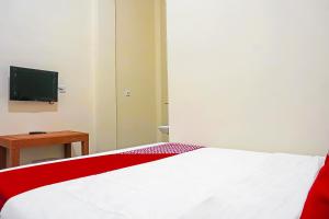 TV a/nebo společenská místnost v ubytování Super OYO Capital O 91790 S1 Residence
