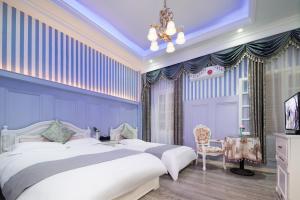 Un ou plusieurs lits dans un hébergement de l'établissement Gulangyu Yuanzhongyuan Homestay