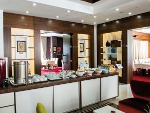 a room with a counter with bowls of food at Siir Boutique Hotel in Denizli