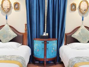 Un ou plusieurs lits dans un hébergement de l'établissement Gulangyu Yuanzhongyuan Homestay