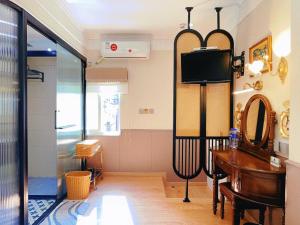 Televizors / izklaižu centrs naktsmītnē Gulangyu Yuanzhongyuan Homestay