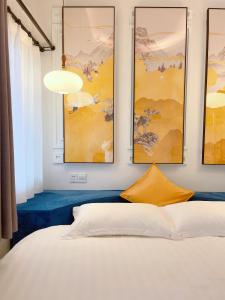 Un ou plusieurs lits dans un hébergement de l'établissement Gulangyu Yuanzhongyuan Homestay