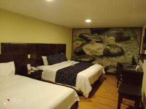 Ένα ή περισσότερα κρεβάτια σε δωμάτιο στο Loft Hotel