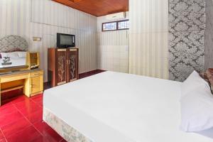 Postel nebo postele na pokoji v ubytování OYO 91829 Hotel Artha
