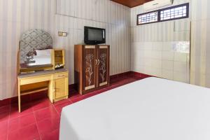 TV a/nebo společenská místnost v ubytování OYO 91829 Hotel Artha