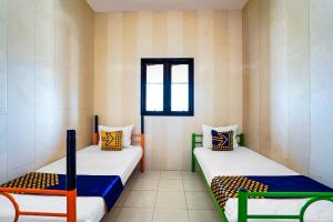 Postel nebo postele na pokoji v ubytování OYO Life 91856 Griya Gedangan Syariah + 23 fotografií