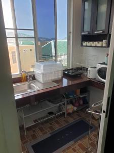 Kuchyň nebo kuchyňský kout v ubytování Monkey Apartment