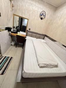 Ένα ή περισσότερα κρεβάτια σε δωμάτιο στο Mabo hotel