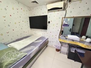Ένα ή περισσότερα κρεβάτια σε δωμάτιο στο Mabo hotel