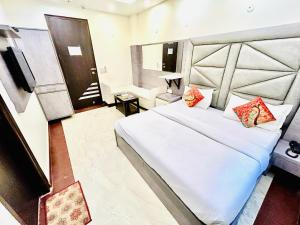 Postel nebo postele na pokoji v ubytování Hotel Amrit Villa + 6 fotografií