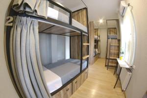 Voodi või voodid majutusasutuse Hostel Nomad toas