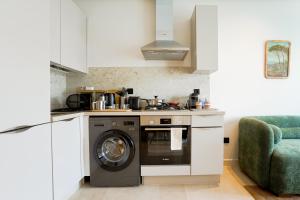 Cucina o angolo cottura di Appartement Pro et Cosy parfait pour séjour d'affaires