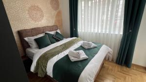 Ένα ή περισσότερα κρεβάτια σε δωμάτιο στο Apartman Lux Jocić