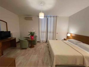 Postel nebo postele na pokoji v ubytování Hotel Clementi