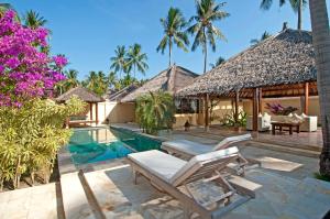a villa with a swimming pool and a resort at Kura Kura Resort in Karimunjawa
