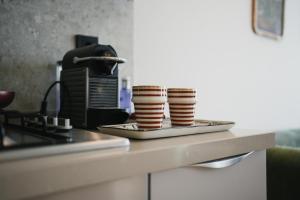 Set per la preparazione di tè e caffè presso Appartement Pro et Cosy parfait pour séjour d'affaires