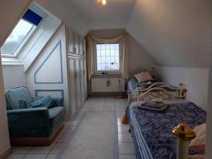 Ein Bett oder Betten in einem Zimmer der Unterkunft Graf Luckner Hüs