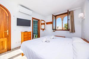 Ένα ή περισσότερα κρεβάτια σε δωμάτιο στο Sa Torre I +28 φωτογραφίες